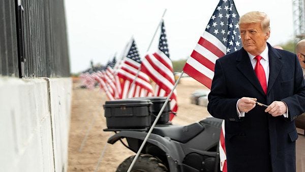 President Donald J. Trump prepares to sign a plaque placed along the border wall Tuesday, Jan. 12, 2021, at the Texas-Mexico border near Alamo, Texas. (Official White House photo by Shealah Craighead)